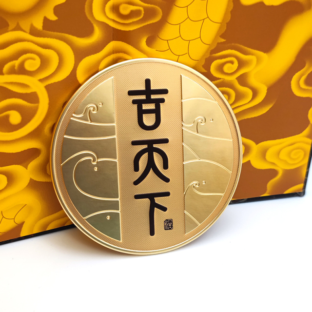 Circular black and gold color-blocked embossed metal wine label