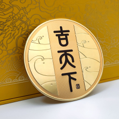 Circular black and gold color-blocked embossed metal wine label