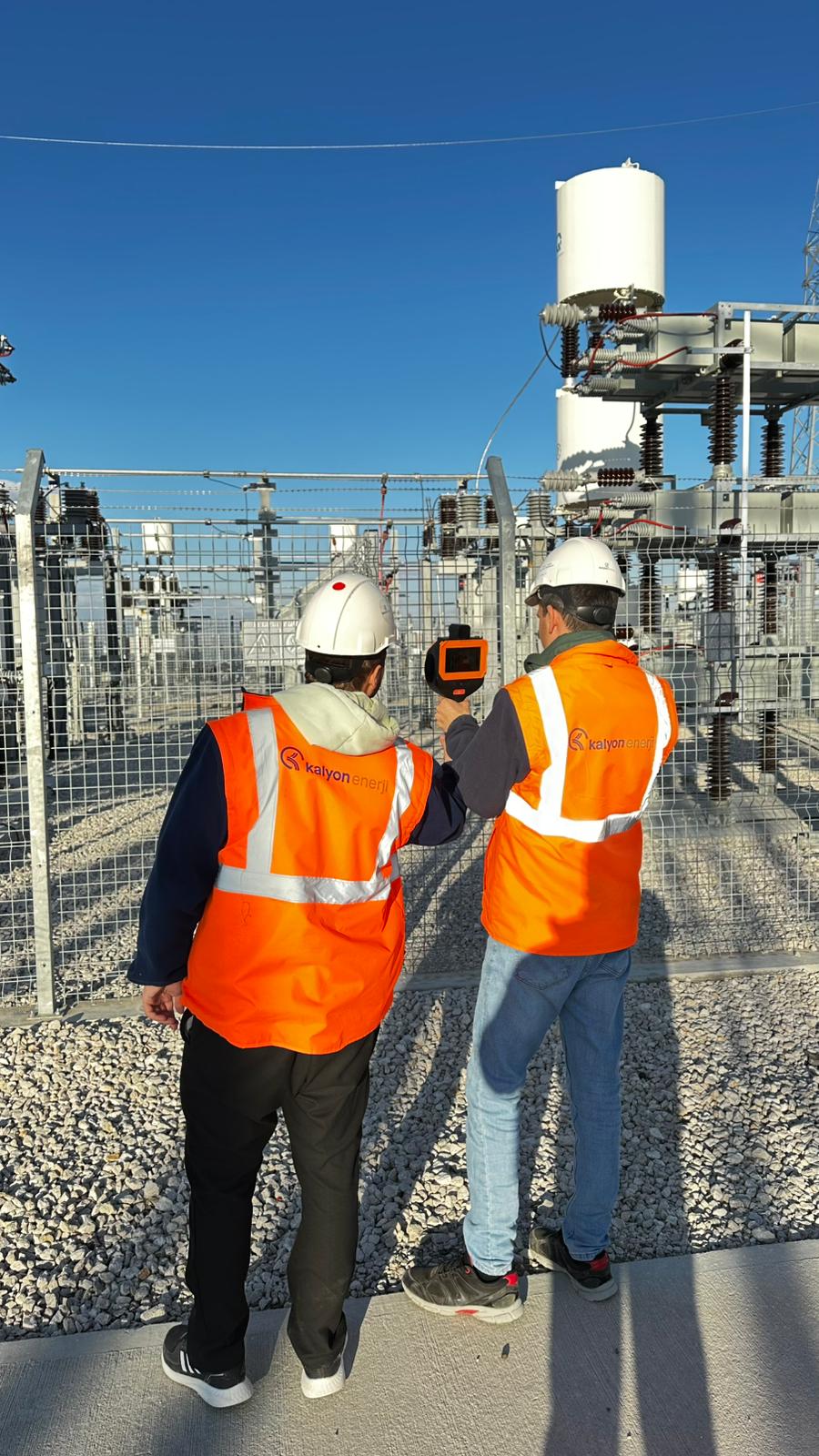 Utility engineer using acoustic thermal imaging for power grid inspection during extreme heat