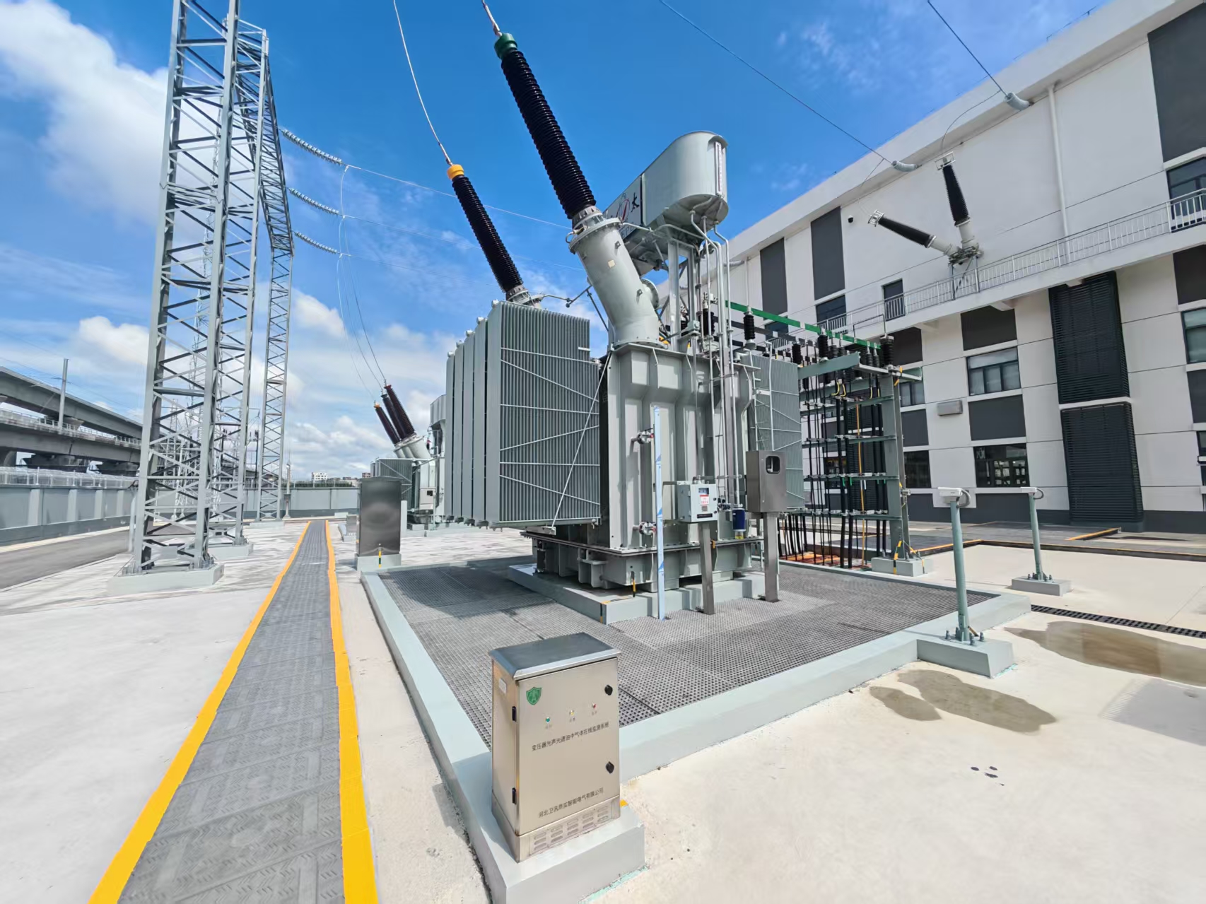 Utility engineer inspecting transformer and high-voltage equipment in a traction-power environment