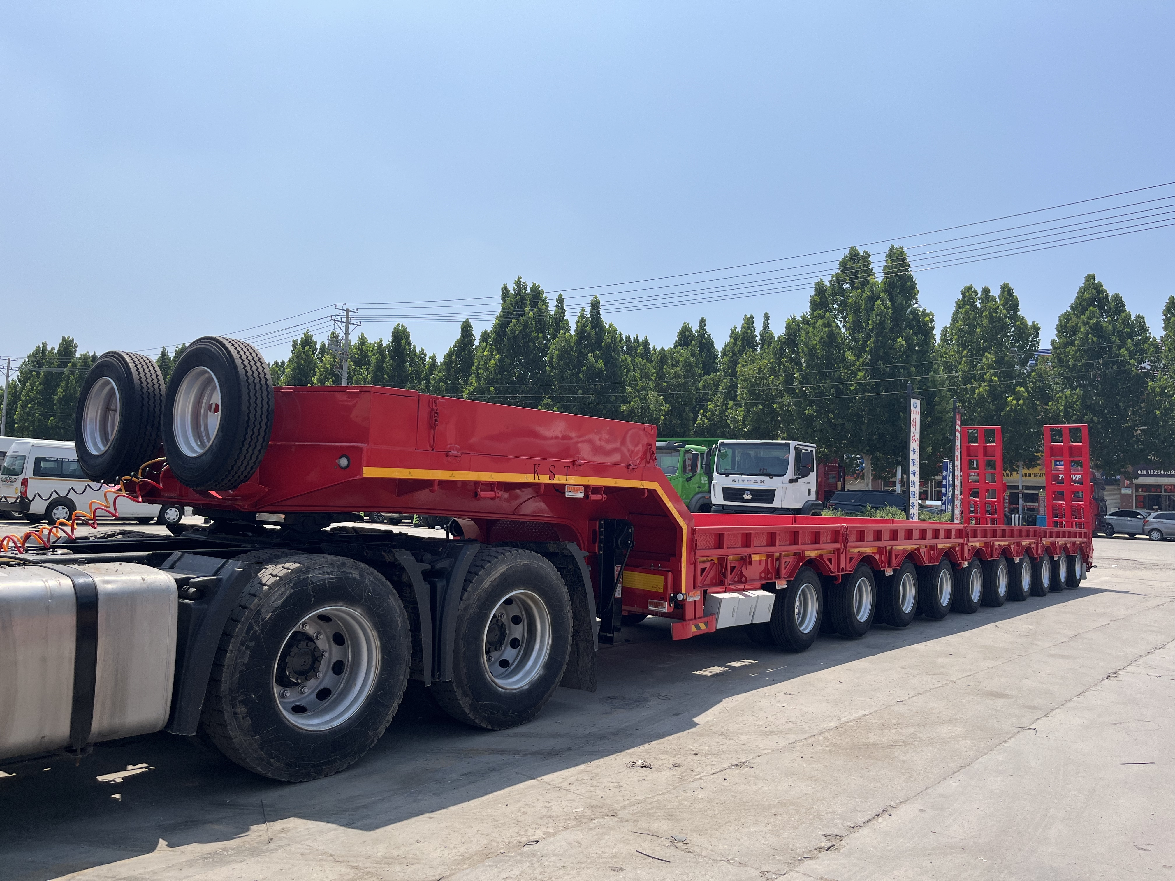 Three-line six-axle high-strength steel low flatbed semi-trailer