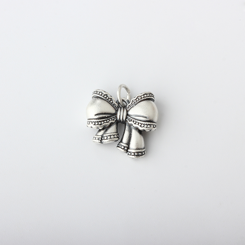 999 Sterling Silver Bow Charm