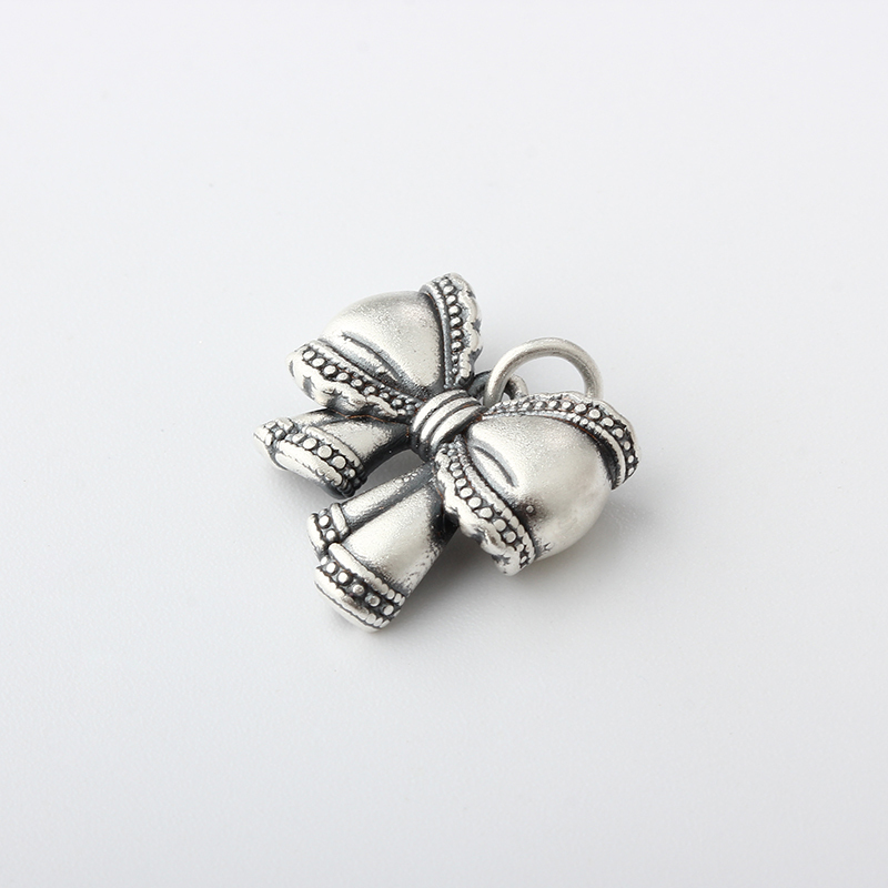 999 Sterling Silver Bow Charm