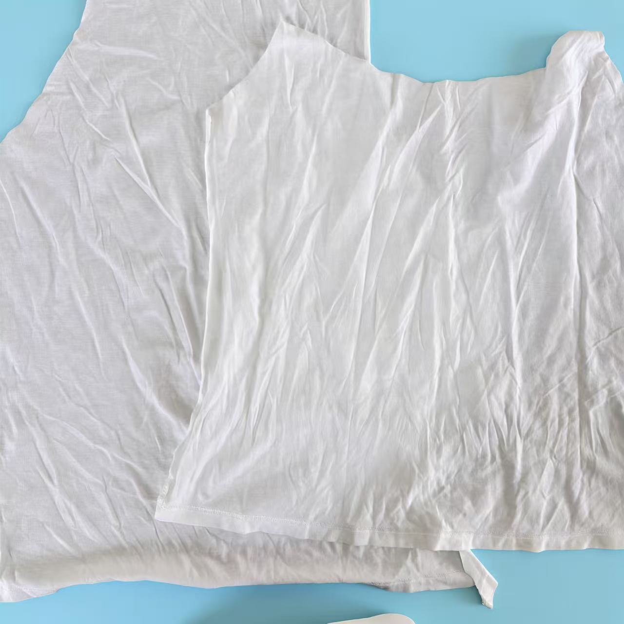 Close-up of Grade A white T-shirt knit rags showing recycled cotton fiber texture, low-lint surface, ideal for precision cleaning tasks.