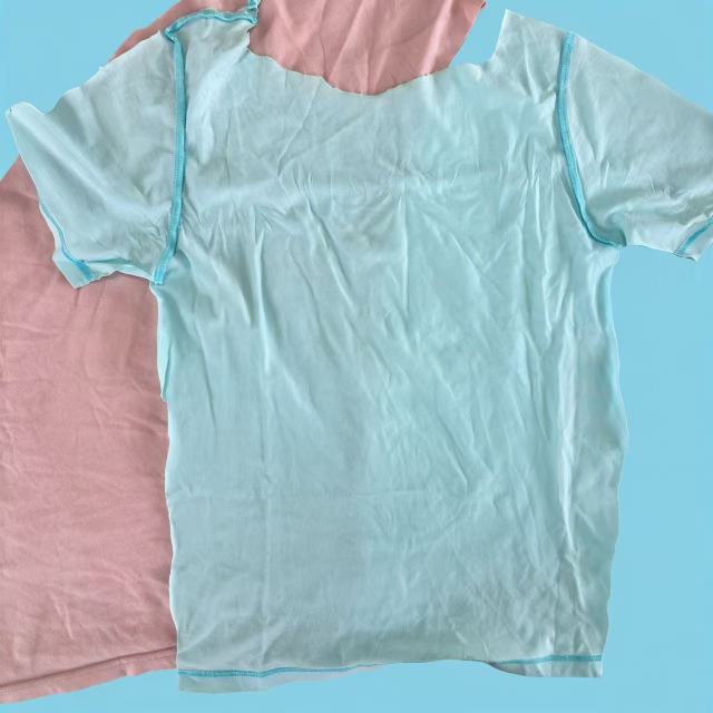 Close-up of light color mixed T-shirt knit rags showing assorted light shades and absorbent knit texture.