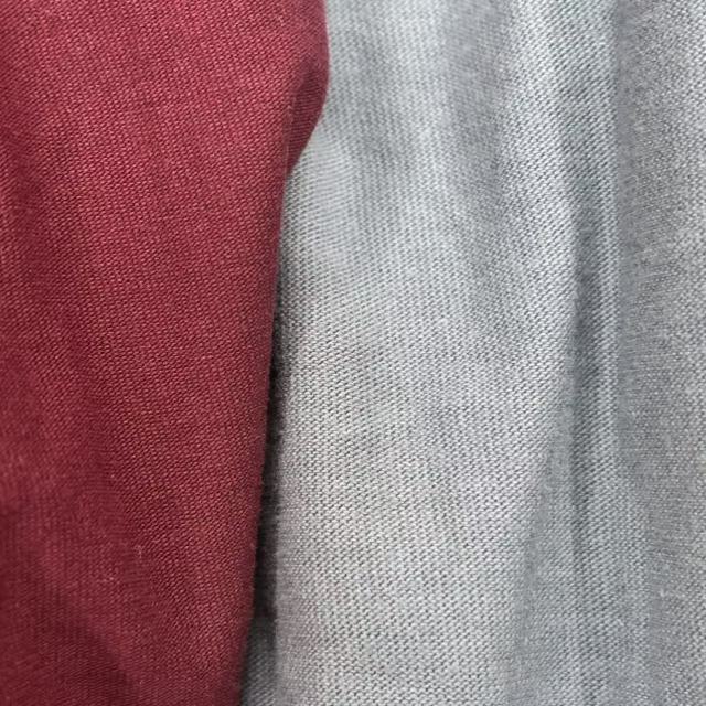Close-up of mixed colored T-shirt knit rags with deep color blend, ideal for stain concealment in dirty environments.