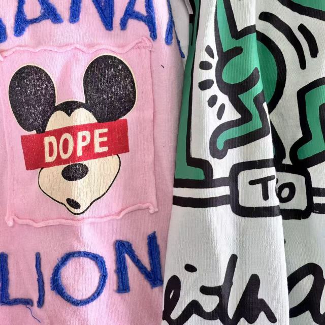 Close-up of printed mixed color T-shirt knit rags showing light-colored base with assorted prints.