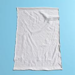 Close-up of custom-cut new cotton wipers showing tailored size and clean edges, perfect for automated processes.
