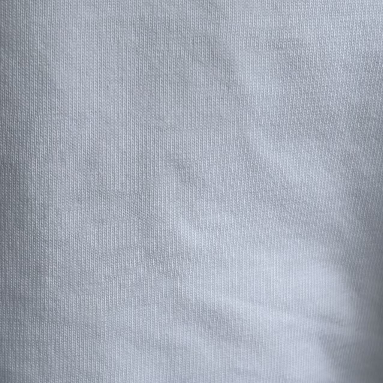 Close-up of custom-cut new cotton wipers showing tailored size and clean edges, perfect for automated processes.