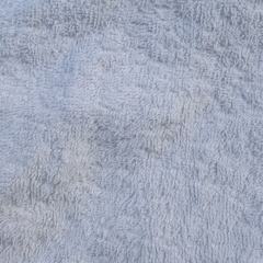 Close-up of Grade A white terry toweling rags showing uniform loops and superior softness for demanding applications.