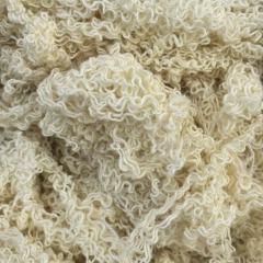 Close-up of off-white hand-sorted cotton yarn waste showing natural color fibers, effective for general maintenance.