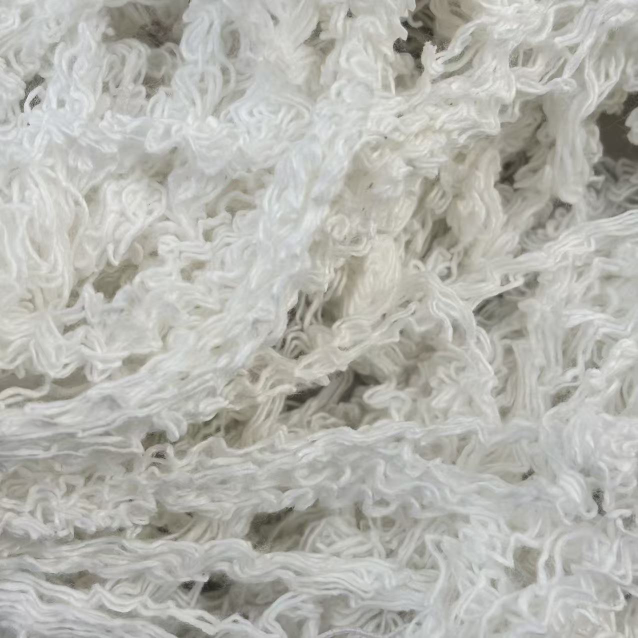 EcoWipePro pure white hand-sorted cotton yarn waste – premium oil sorbent for marine engine rooms, high-visibility applications.