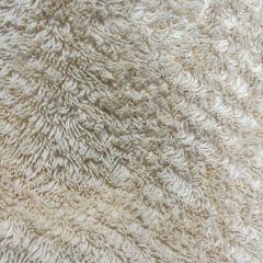 Close-up of uncut colored terry toweling rags showing full towel size and absorbent loop texture.