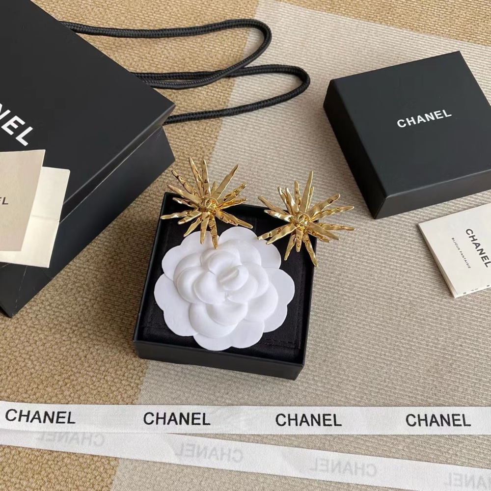 CHANEL GOLD TEXTURED STARBURST METAL EARRINGS