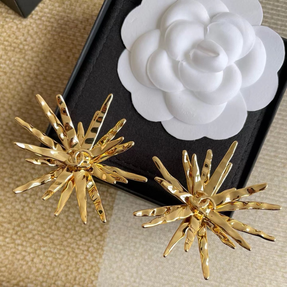 CHANEL GOLD TEXTURED STARBURST METAL EARRINGS