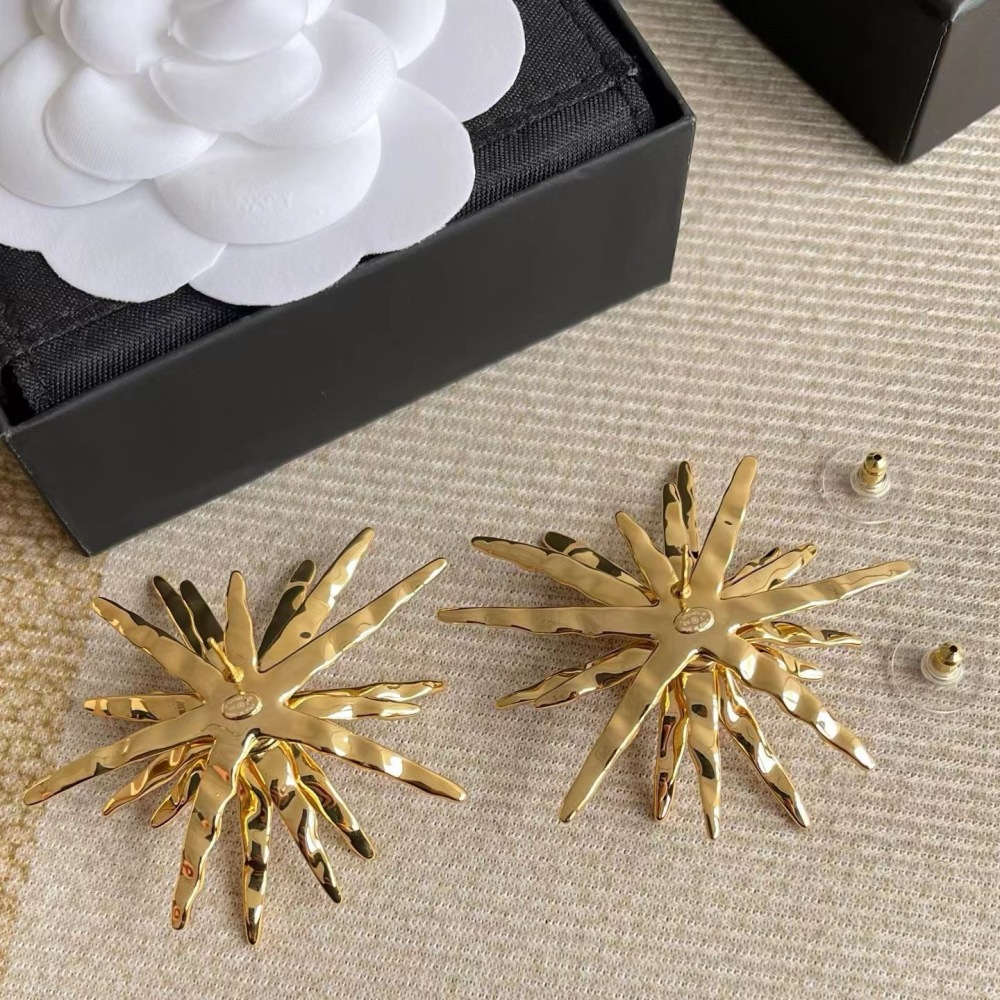 CHANEL GOLD TEXTURED STARBURST METAL EARRINGS