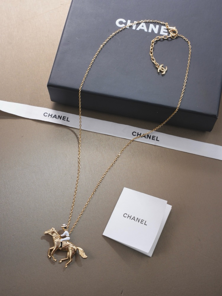 CHANEL HORSE RIDER GOLD PENDANT NECKLACE