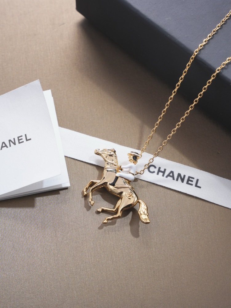 CHANEL HORSE RIDER GOLD PENDANT NECKLACE