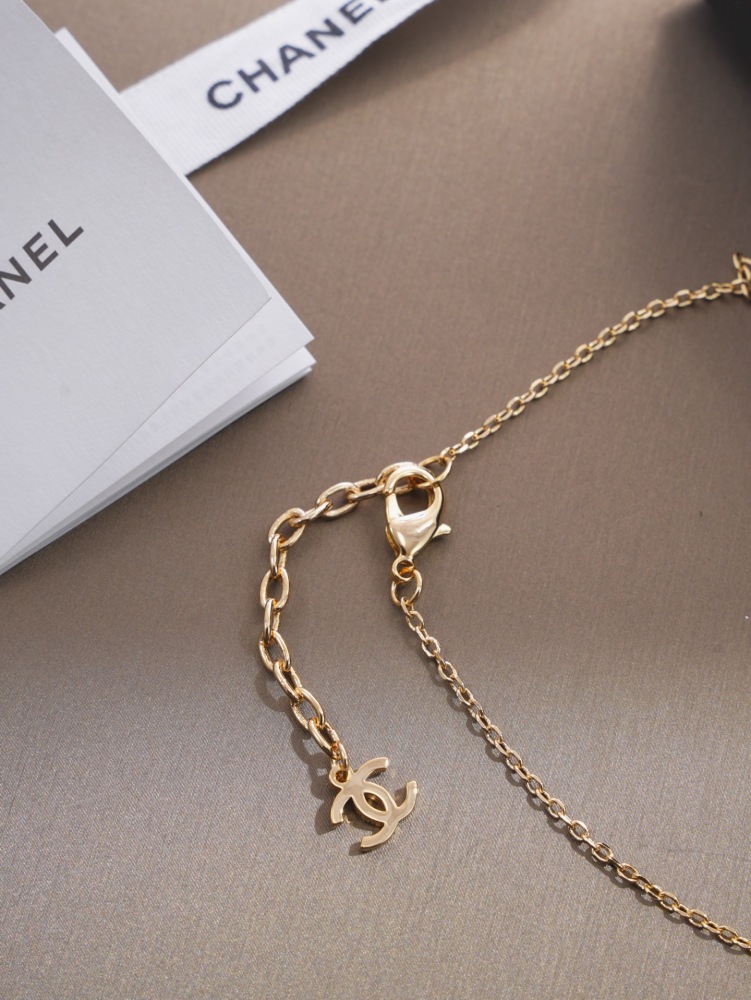 CHANEL HORSE RIDER GOLD PENDANT NECKLACE