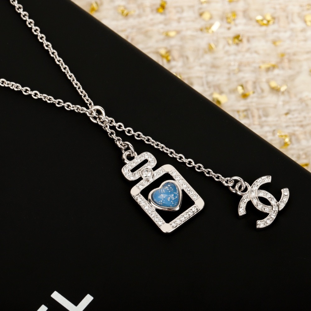 CHANEL PERFUME BOTTLE BLUE HEART INTERLOCKING CC NECKLACE