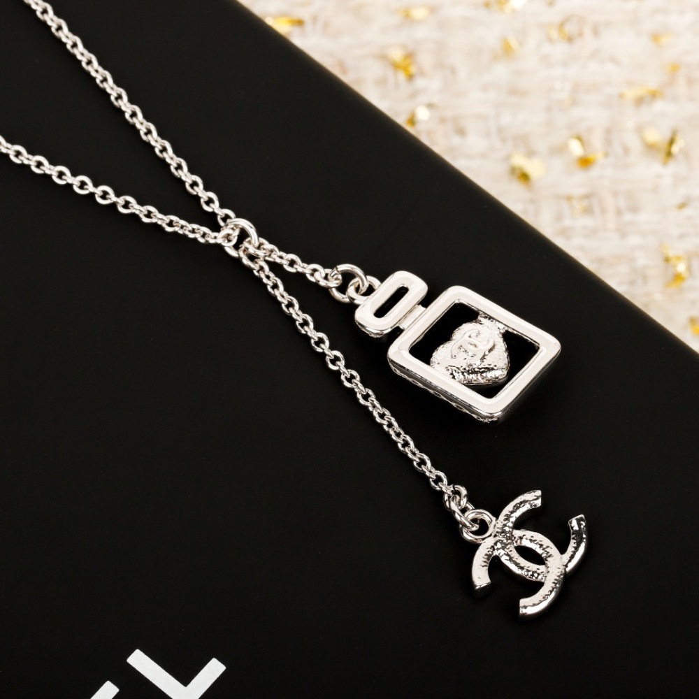 CHANEL PERFUME BOTTLE BLUE HEART INTERLOCKING CC NECKLACE