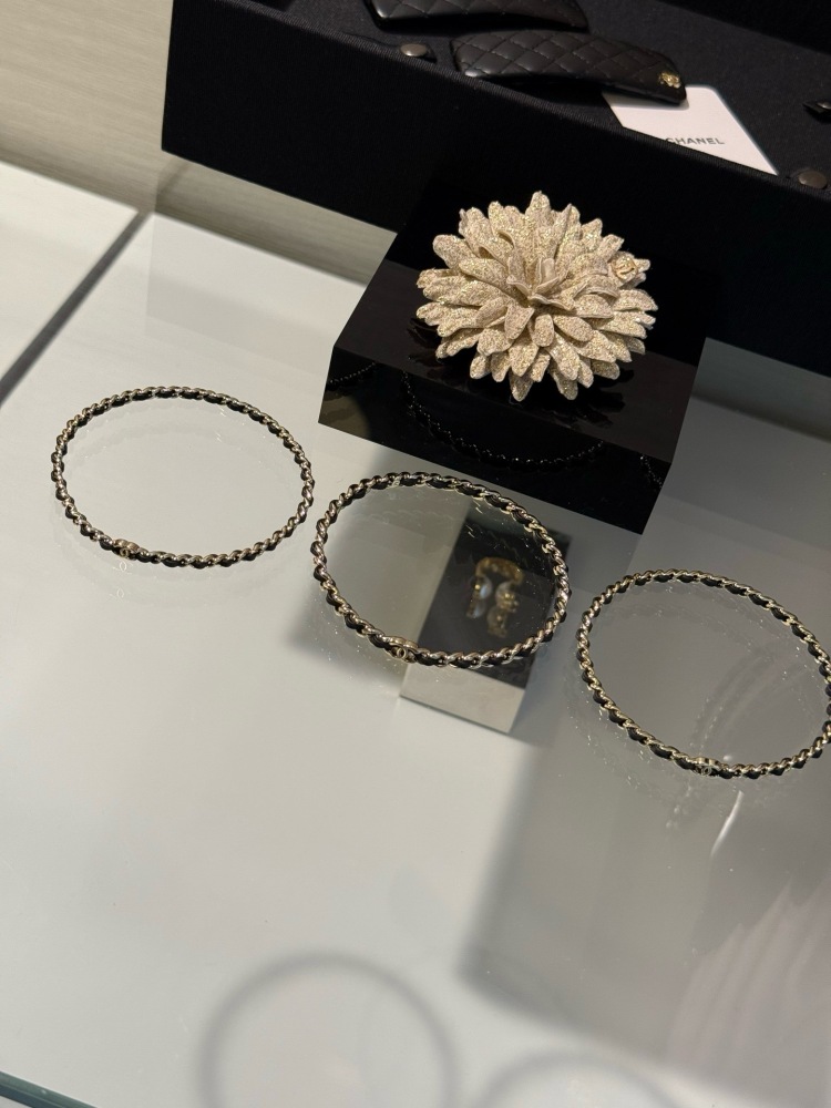 CHANEL TRIPLE ROW INTERWOVEN LEATHER CHAIN BANGLE