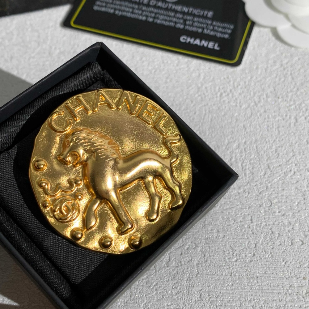 CHANEL GOLD ROUND COIN LION EMBOSSED BROOCH