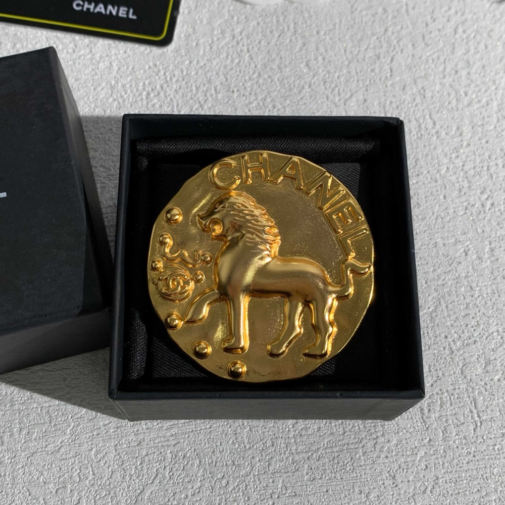 CHANEL GOLD ROUND COIN LION EMBOSSED BROOCH