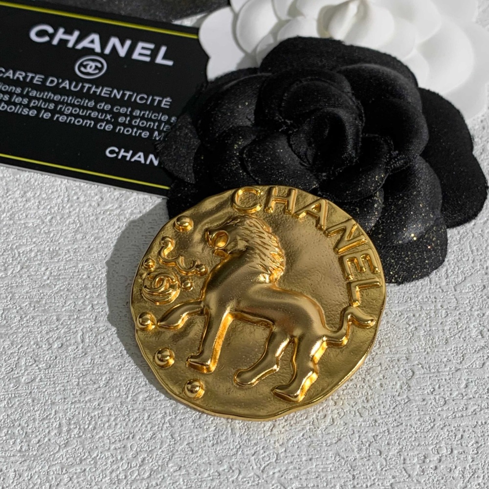 CHANEL GOLD ROUND COIN LION EMBOSSED BROOCH