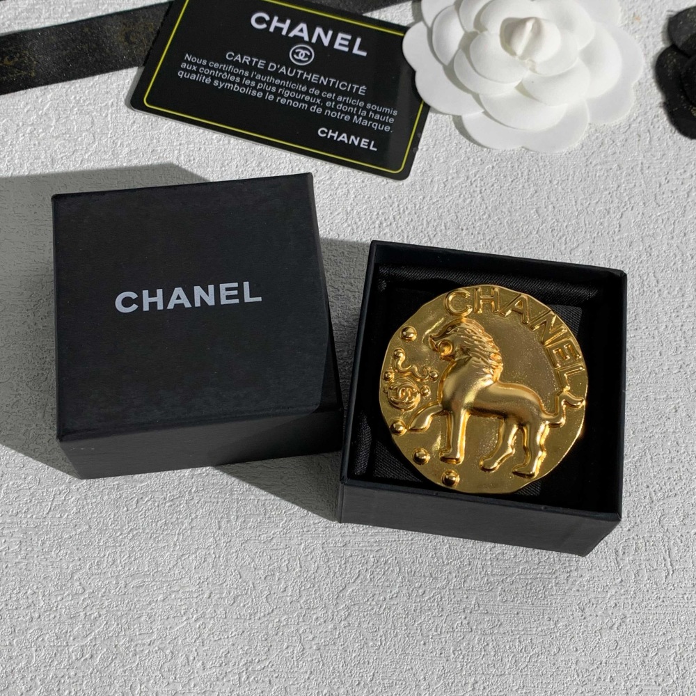 CHANEL GOLD ROUND COIN LION EMBOSSED BROOCH