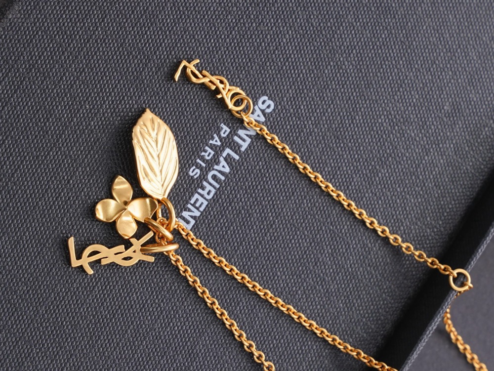 SAINT LAURENT MULTI-CHARM GOLD-TONE NECKLACE