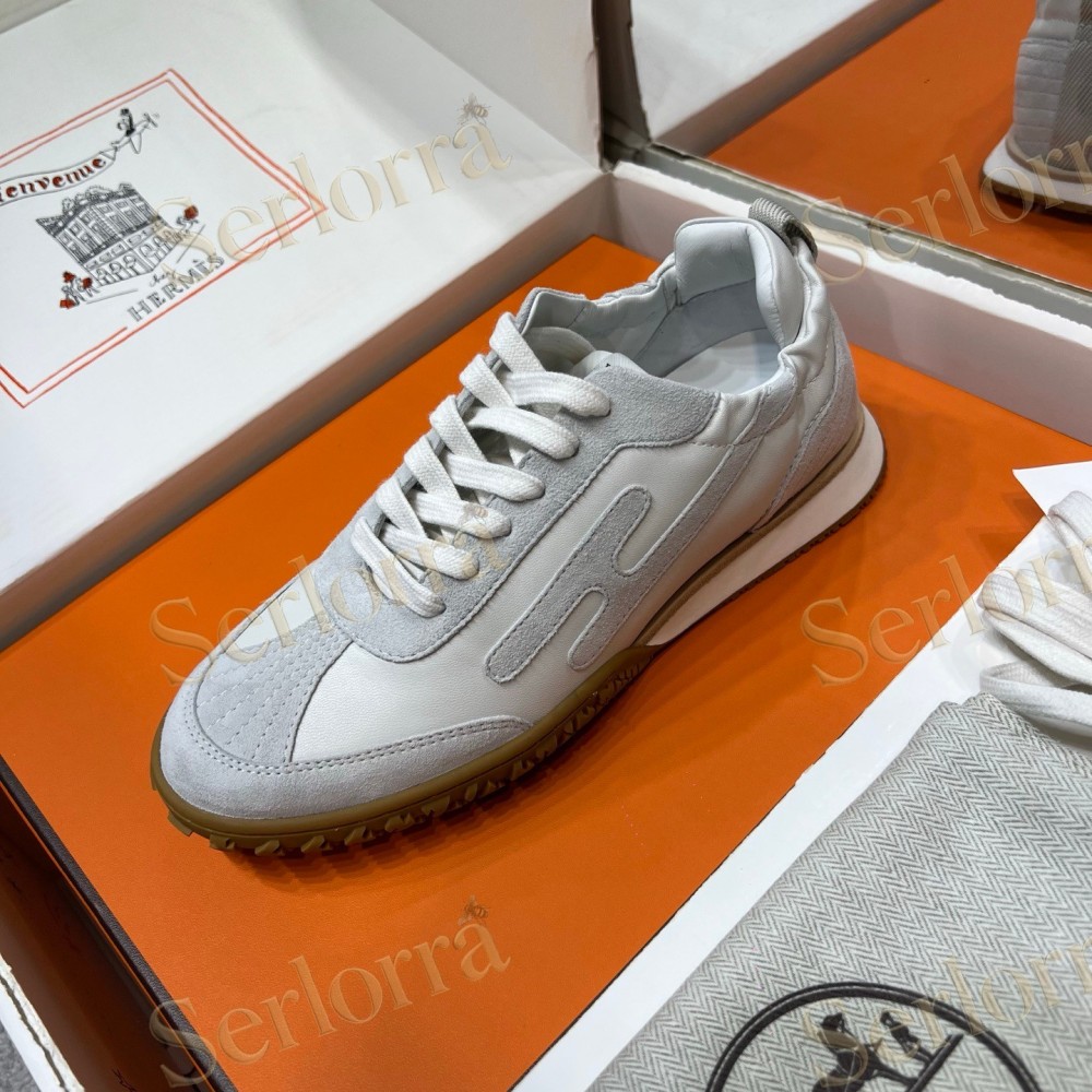 HERMÈS LIGHT SUEDE AND LEATHER JET LOW‑TOP SNEAKERS