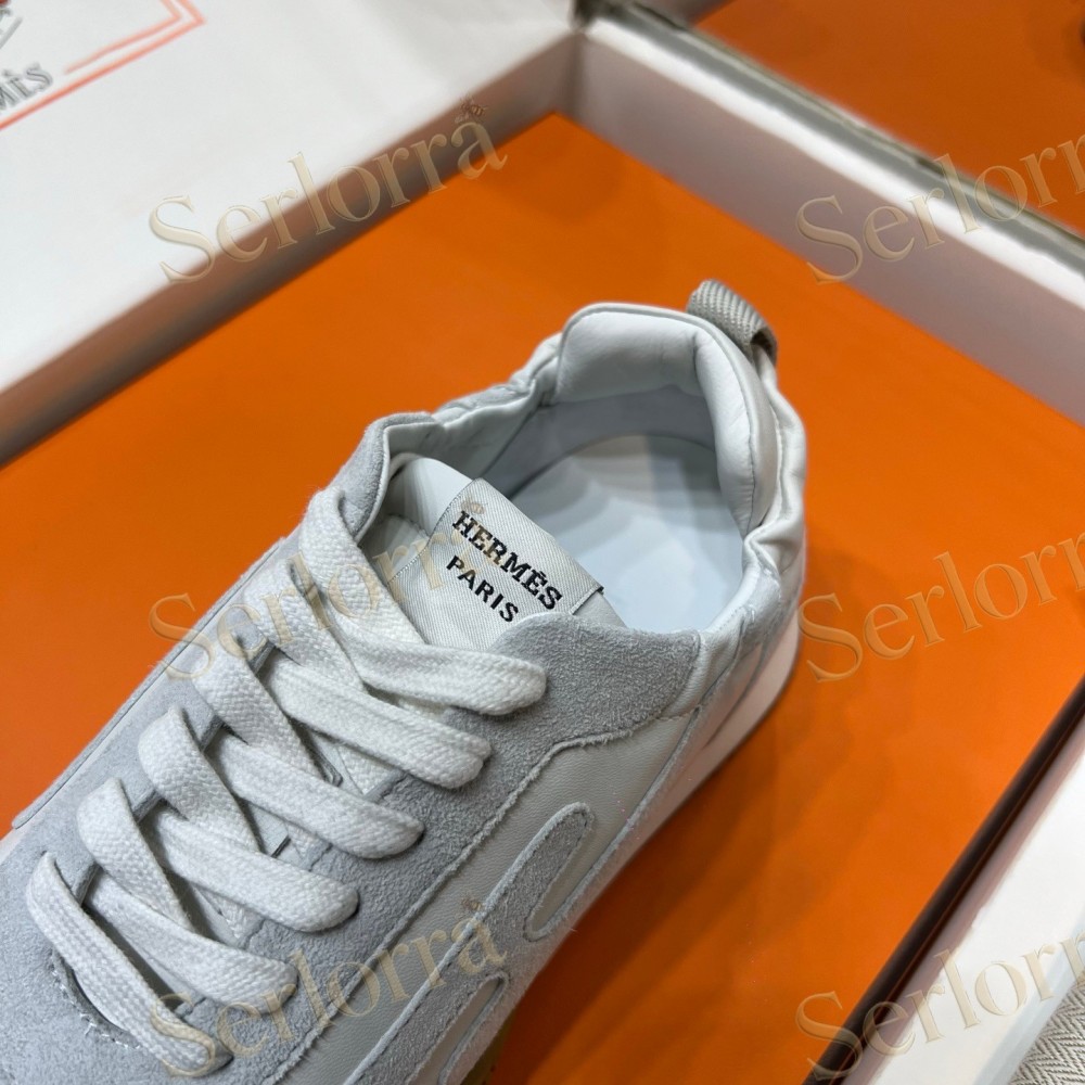 HERMÈS LIGHT SUEDE AND LEATHER JET LOW‑TOP SNEAKERS