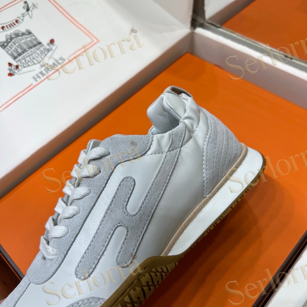 HERMÈS LIGHT SUEDE AND LEATHER JET LOW‑TOP SNEAKERS