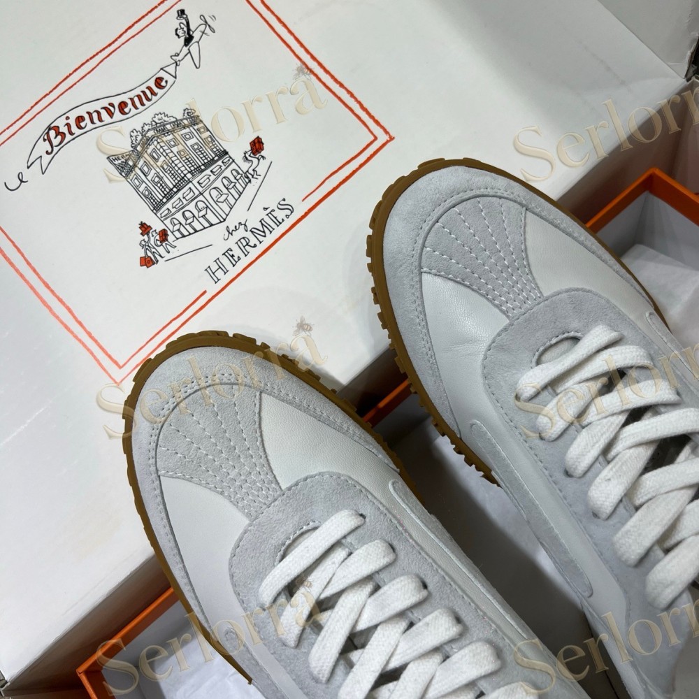 HERMÈS LIGHT SUEDE AND LEATHER JET LOW‑TOP SNEAKERS