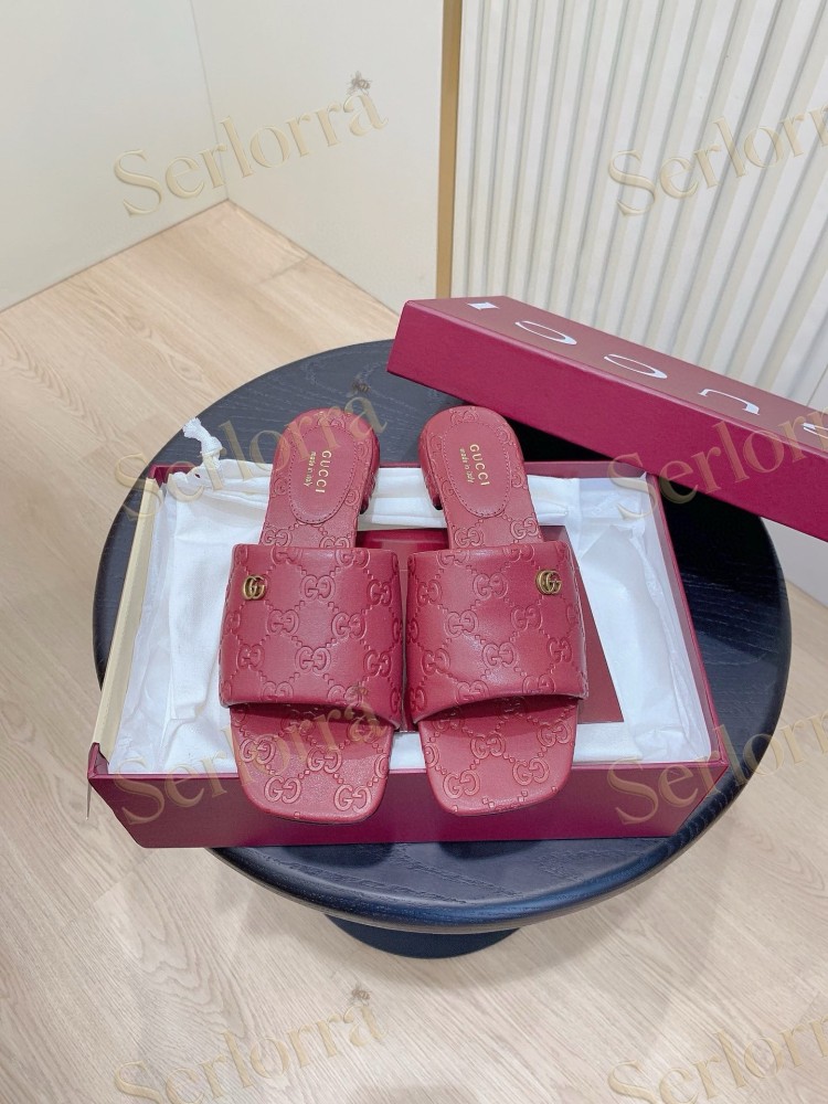 GUCCI ALL-OVER GG EMBOSSED LEATHER DOUBLE G SLIDE SANDALS