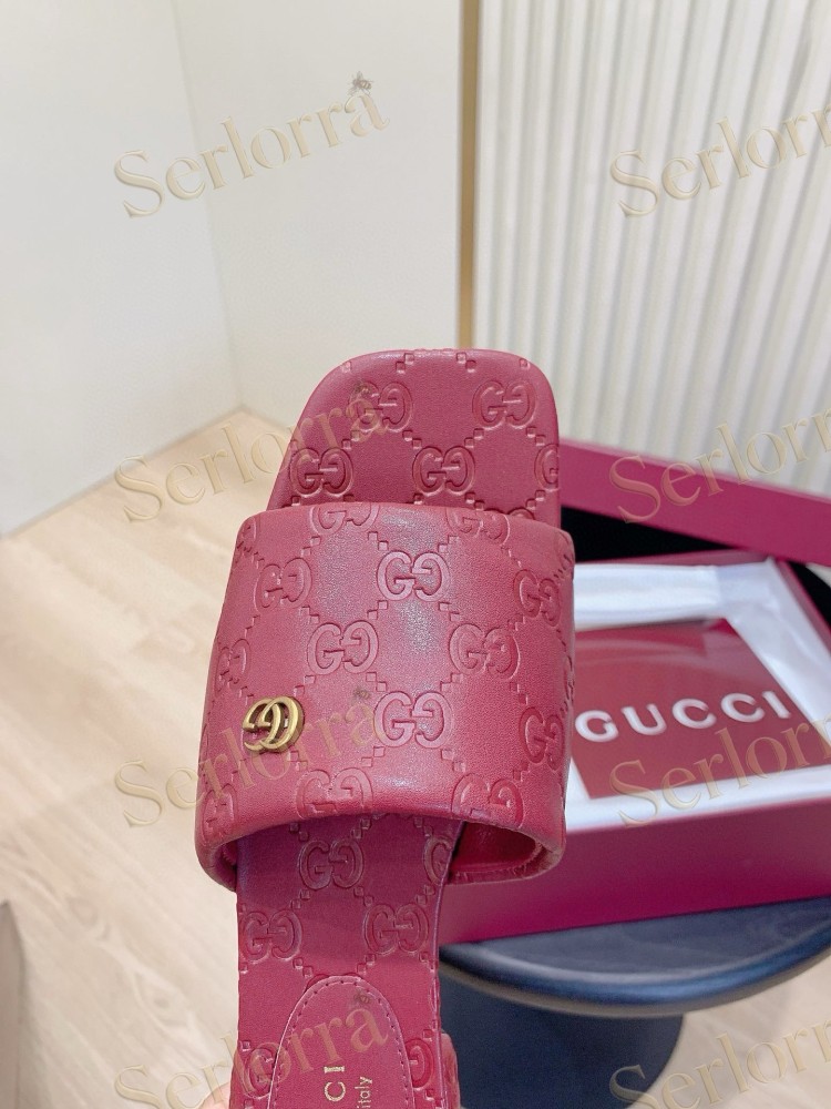 GUCCI ALL-OVER GG EMBOSSED LEATHER DOUBLE G SLIDE SANDALS