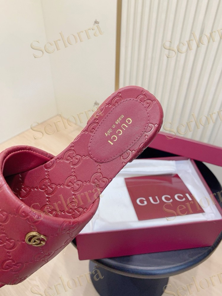 GUCCI ALL-OVER GG EMBOSSED LEATHER DOUBLE G SLIDE SANDALS