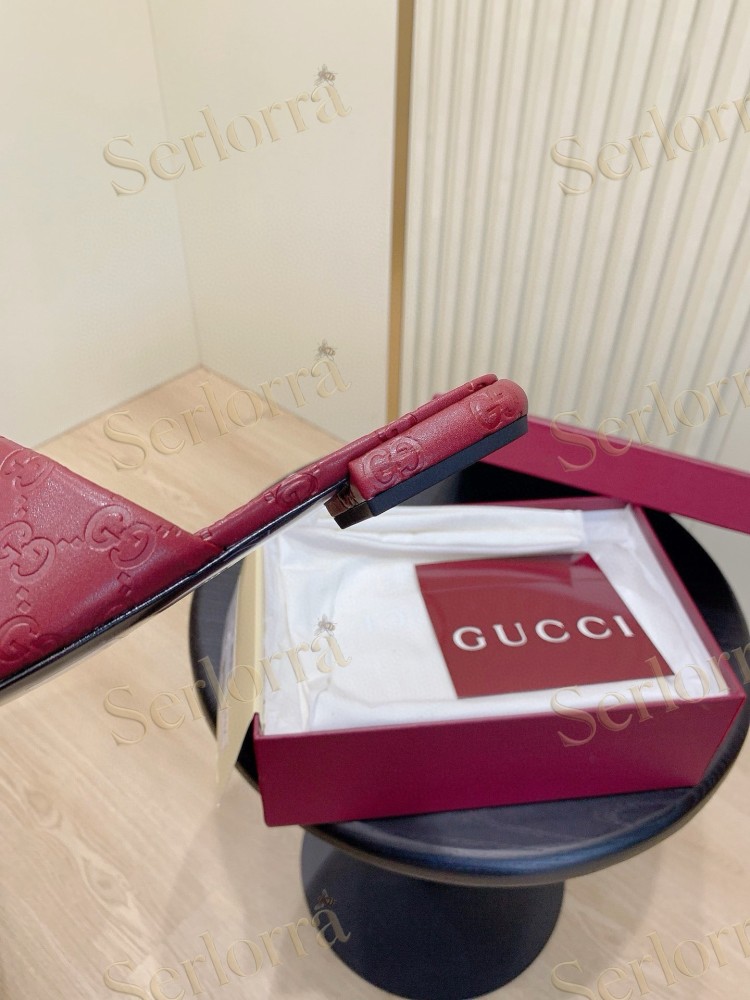 GUCCI ALL-OVER GG EMBOSSED LEATHER DOUBLE G SLIDE SANDALS