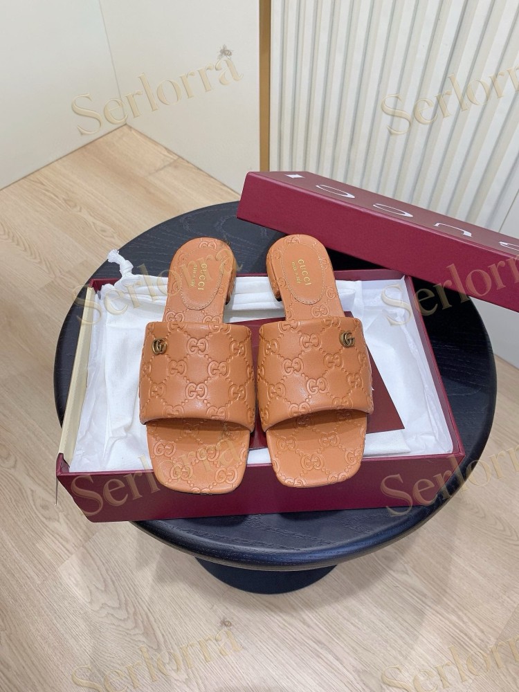 GUCCI ALL-OVER GG EMBOSSED LEATHER DOUBLE G SLIDE SANDALS