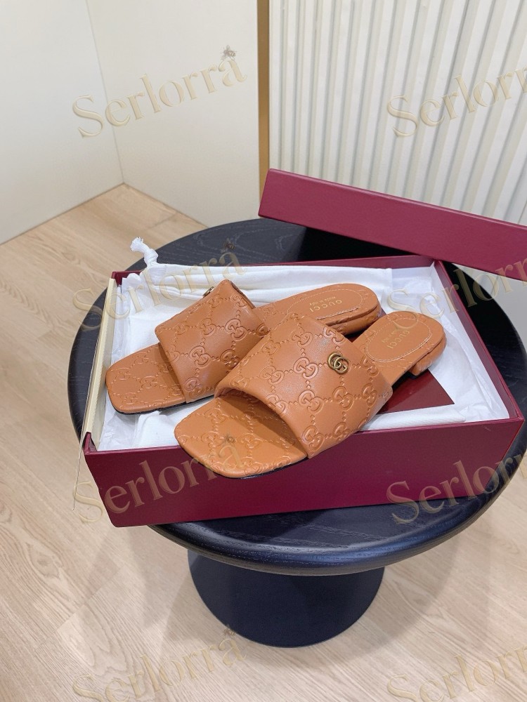 GUCCI ALL-OVER GG EMBOSSED LEATHER DOUBLE G SLIDE SANDALS