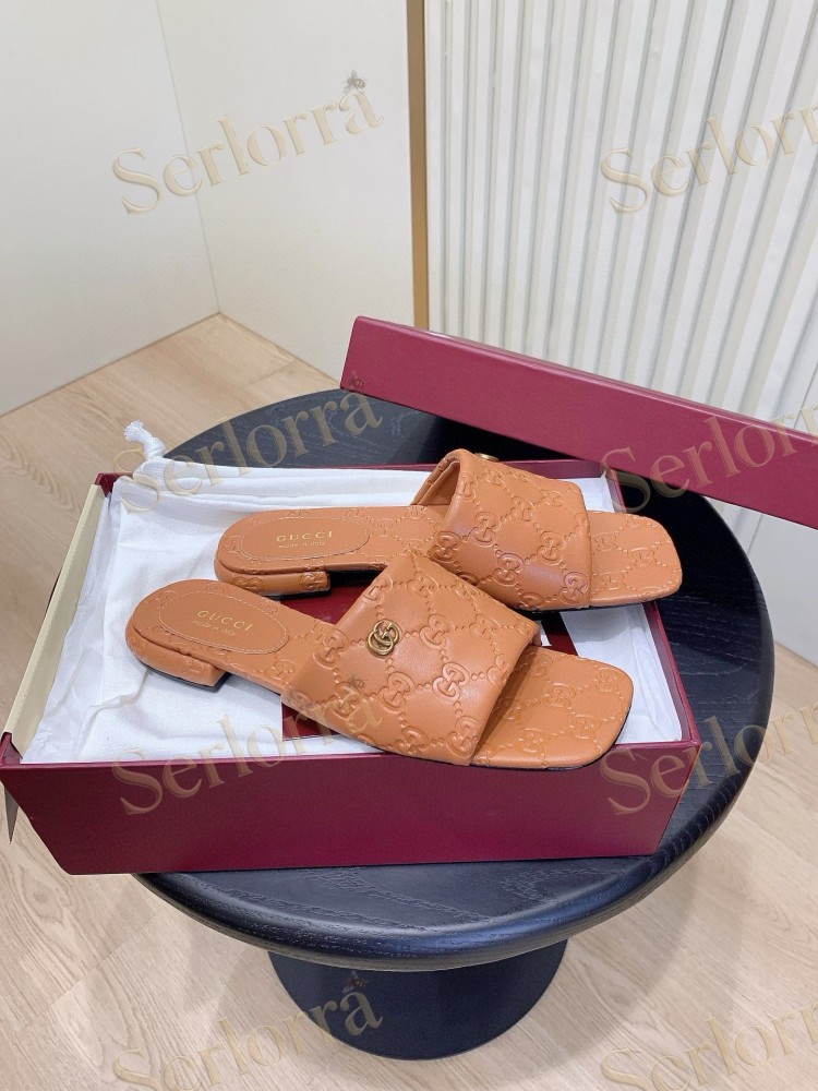 GUCCI ALL-OVER GG EMBOSSED LEATHER DOUBLE G SLIDE SANDALS