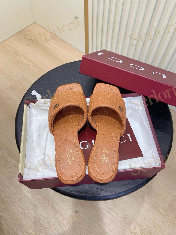 GUCCI ALL-OVER GG EMBOSSED LEATHER DOUBLE G SLIDE SANDALS