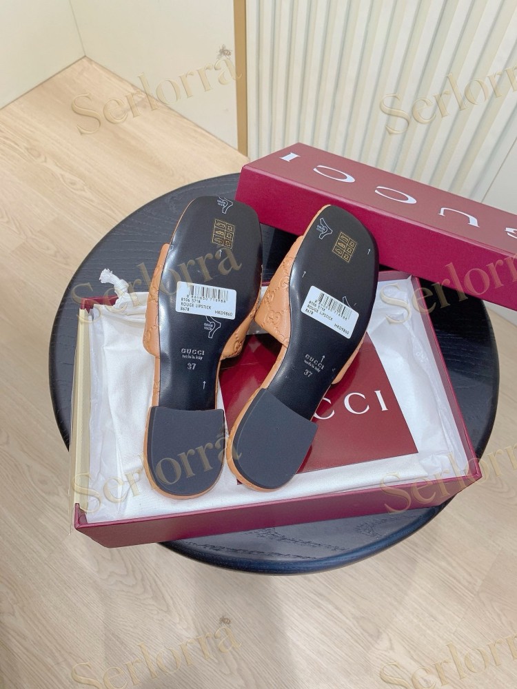GUCCI ALL-OVER GG EMBOSSED LEATHER DOUBLE G SLIDE SANDALS