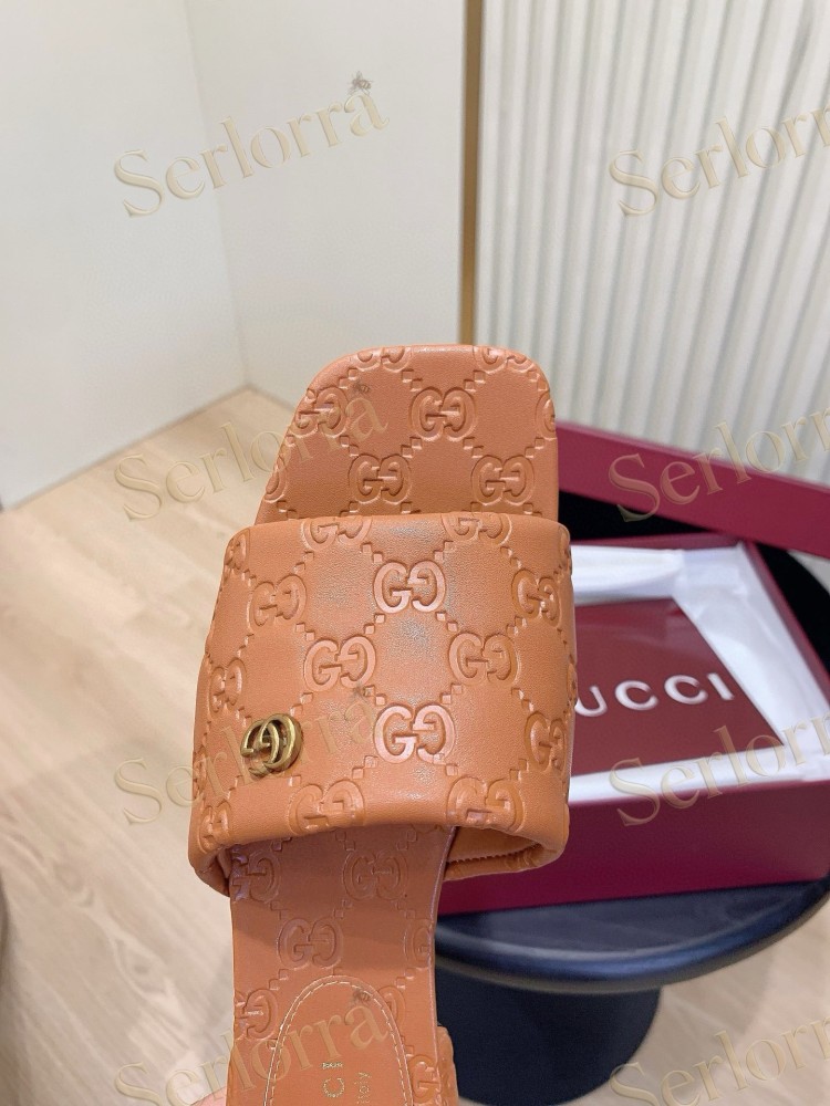 GUCCI ALL-OVER GG EMBOSSED LEATHER DOUBLE G SLIDE SANDALS