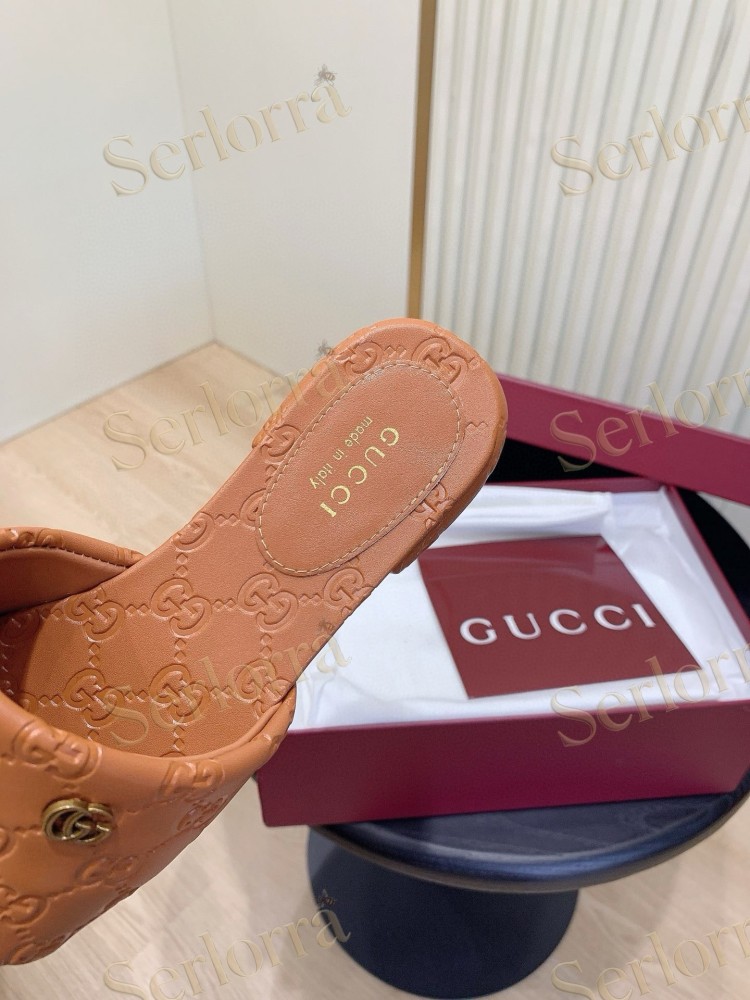 GUCCI ALL-OVER GG EMBOSSED LEATHER DOUBLE G SLIDE SANDALS