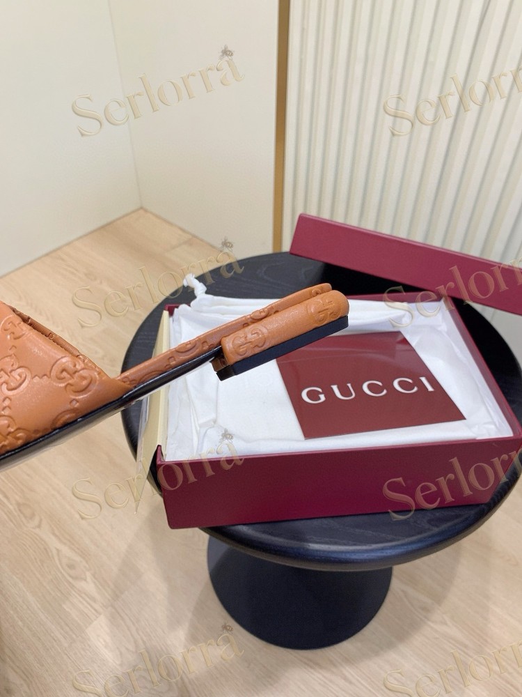 GUCCI ALL-OVER GG EMBOSSED LEATHER DOUBLE G SLIDE SANDALS