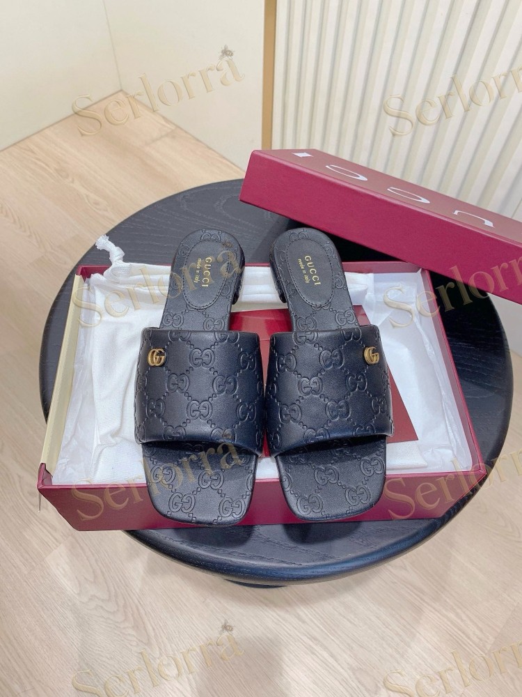 GUCCI ALL-OVER GG EMBOSSED LEATHER DOUBLE G SLIDE SANDALS