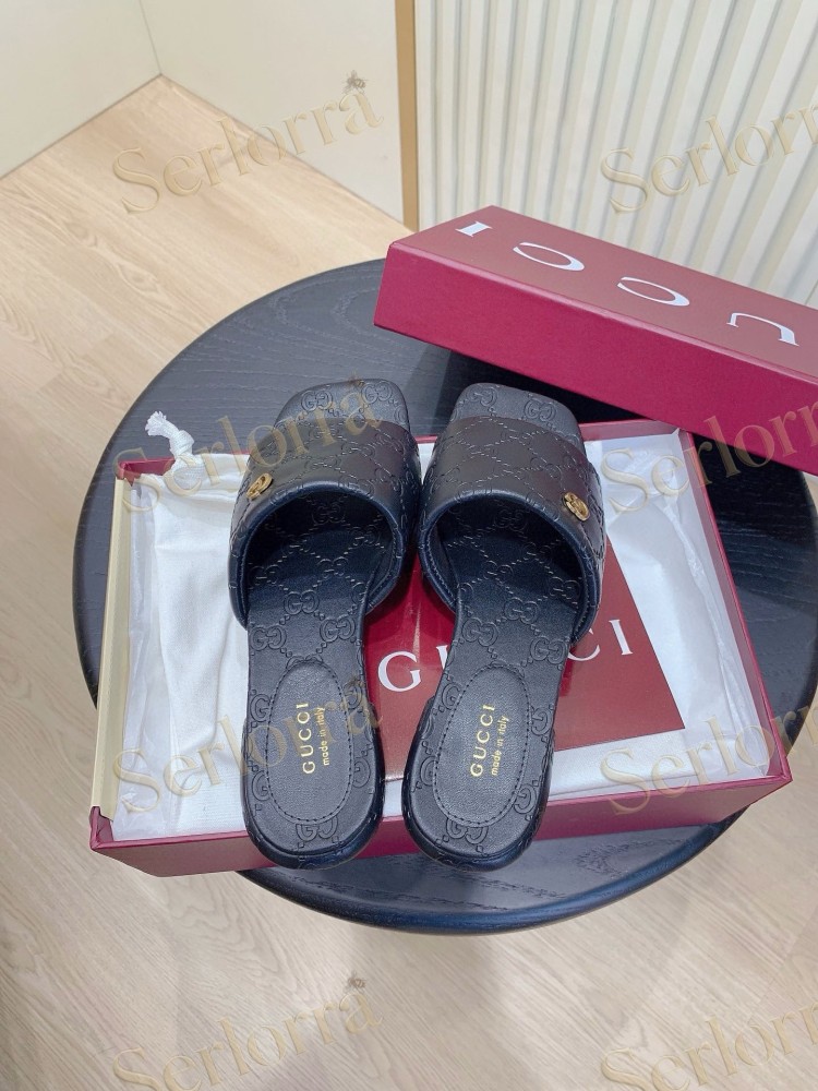 GUCCI ALL-OVER GG EMBOSSED LEATHER DOUBLE G SLIDE SANDALS