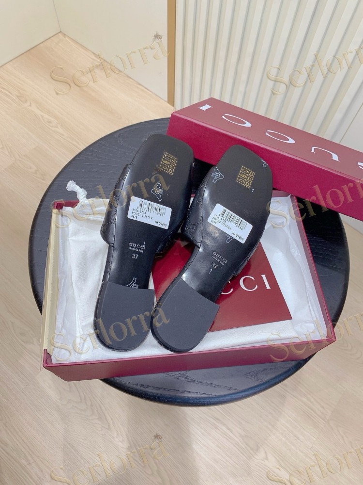 GUCCI ALL-OVER GG EMBOSSED LEATHER DOUBLE G SLIDE SANDALS